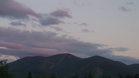 Sunset-timelapse-of-ski-mountain-in-new-England-with-clouds-moving