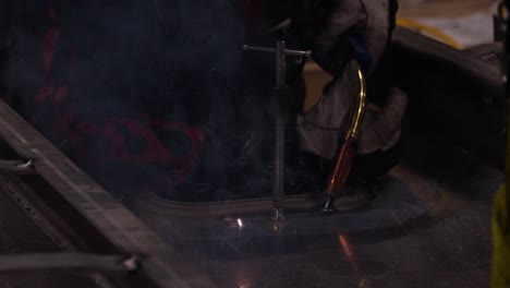 Bright-blue-sparks-from-a-welding-machine-in-slow-motion