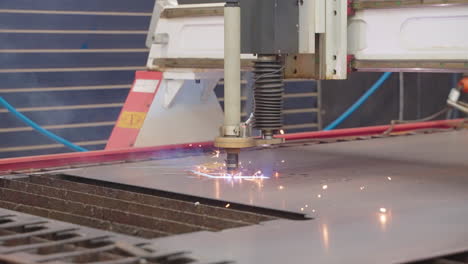 Slow-Motion-Close-Up-Of-Plasma-Cutting-Sheet-Of-Steel-With-Sparks-In-Metal-Workshop,-4K