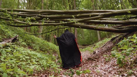 A-Man-In-Hoodie-Black-Cloak-Is-Doing-A-Crazy-Dance-Moves-Inside-The-Forest