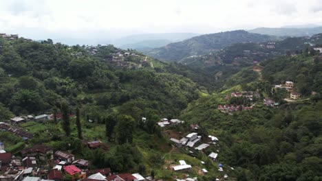 Aerial-shot-of-small-houses-on-hills-in-Kohima,-Nagaland
