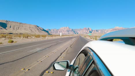 Driving-on-the-road-with-view-of-Red-Rock-Canyon-in-Nevada-from-a-car
