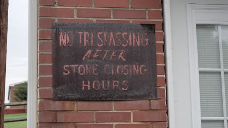 No-Trespassing-Sign-at-an-Abandoned-Business-in-an-Urban-Neighborhood-Slo-Motion