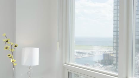 Reveal-the-view-from-the-bedroom-of-a-high-rise-condominium-unit