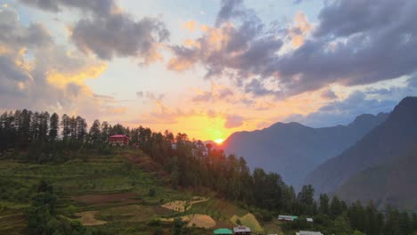 Drone-Shot-of-sunset-in-a-small-village-in-Sainj-Valley-in-Himachal-Pradesh-near-Manali,-Kasol-5