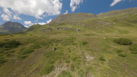 FPV-Aerial-Flying-Over-Silvretta-Stausee-Valley-Floor-Across-Expansive-Landscape