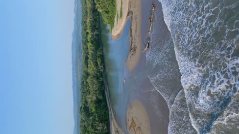 Vertical-Shot-Of-Rio-Munoz-Rivermouth-On-The-Atlantic-Coast-Of-Puerto-Plata-In-The-Dominican-Republic