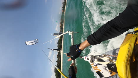 POV-vertical-GoPro,-person-kite-surfing-doing-acrobatic-tricks-on-ocean