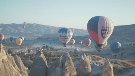 Hot-air-balloons-over-fairy-chimneys-Goreme,-Cappadocia