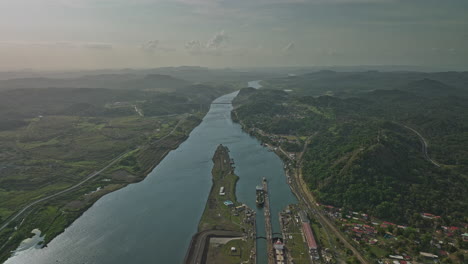 Panama-City-Aerial-v37-high-angle-flyover-miraflores-lake-across-pedro-miguel-locks-canal-with-cargo-ships-transiting-at-the-station-leading-to-atlantic-ocean---Shot-with-Mavic-3-Cine---March-2022
