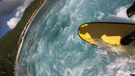 POV-vertical-GoPro-of-surfer-surfing-on-tropical-ocean-wave