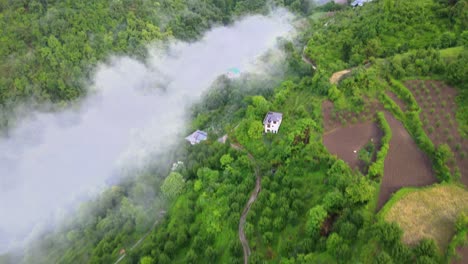 Drone-Shot-of-a-cloudy-Sainj-Valley-in-Himachal-Pradesh-near-Manali,-Kasol-15