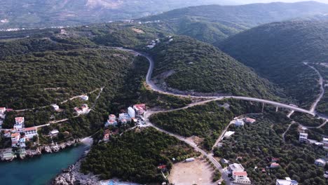 Coastal-road-in-Montenegro-on-green-forest-hill,-aerial