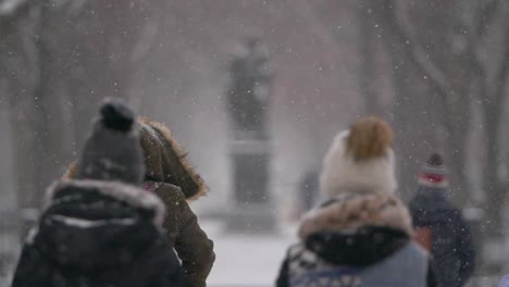 Slow-motion-of-people-walking-on-a-snowy-day-in-Boston