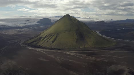 Maelifell-Volcano-Against-Cloudy-Sky-In-Southern-Iceland---aerial-shot