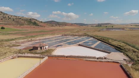 Ponds-of-water-evaporating-for-salt-mining-operations-in-Imon,-Spain