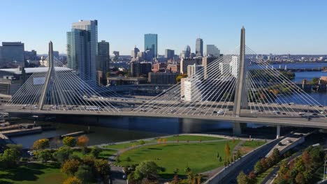 Aerial-view-of-Boston-Zakim-Bridge-in-the-summer-with-blue-skies-and-highway-traffic