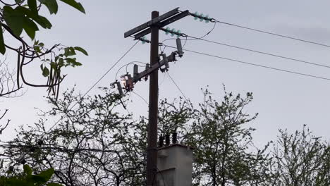 Electric-Wires-Cables-and-Pole,-Power-Lines-and-Electrical-Equipment-Connector-Conductor-in-Fire-Burning,-Electricity-Short-Circuit-Danger-and-Risk-due-to-Technical-Problem-after-Storm