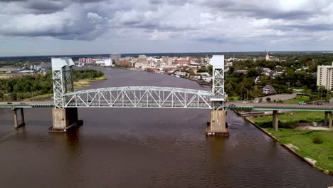 Aerial-pullout-from-the-vertical-lift-bridge-over-the-cape-fear-river-at-wilmington-nc,-north-carolina,-the-cape-fear-memorial-bridge