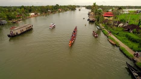 Dozens-of-people-in-a-long-canoe-training-on-Kumarakom-river-for-Kerala-national-Vallam-Kali-racing-competition