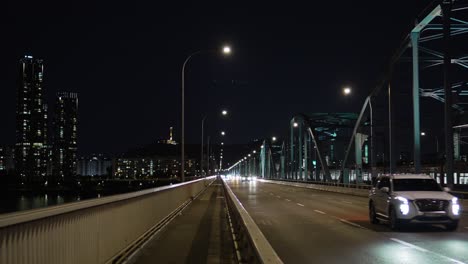 Seoul-Night-Traffic-on-Dongjak-bridge,-metro-train-line-4-crossing-Han-River