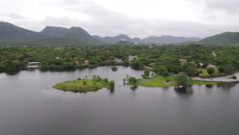 Drone-flying-over-Fateh-Sagar-lake-and-Sajjangarh-Monsoon-palace-in-background