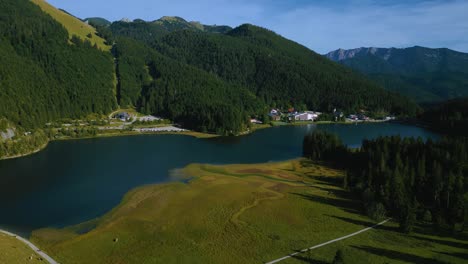 Lake-Spitzingsee-in-the-Bavarian-Austrian-Sudelfeld-Wendelstein-alps-mountain-peaks-with-romantic-and-lush-green-grass-meadows-1