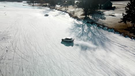 Aerial-view-of-bmw-drifting-on-a-curbe-at-the-iced-track-from-Poynette-Wisconsin