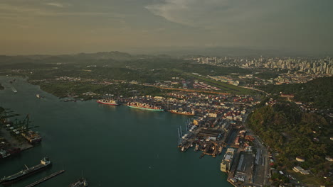 Panama-City-Aerial-v49-high-angle-panoramic-view-capturing-port-of-balboa,-ancon-hill,-downtown-cityscape-and-historic-district-surrounded-by-water-canal---Shot-with-Mavic-3-Cine---March-2022