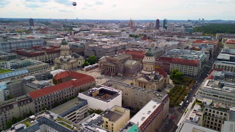 Gorgeous-aerial-view-flight-panorama-curved-drone
of-French-and-German-Cathedral-Dom-on-Gendarmenmarkt-place-in-Berlin-Germany-at-summer-day-2022