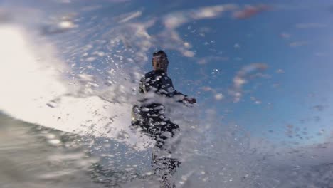 Close-up-shot-of-Handsome-guy-surfing-a-green-wave-in-Praia-da-Arda-surf-spot