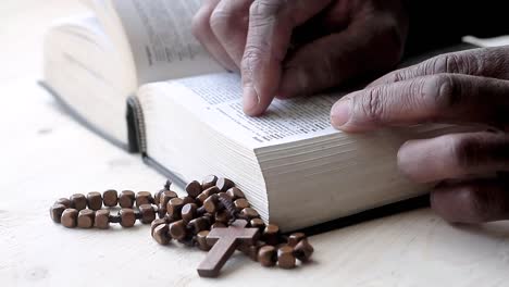 Praying-to-God-with-hand-on-bible-with-white-background-with-people-stock-footage-1