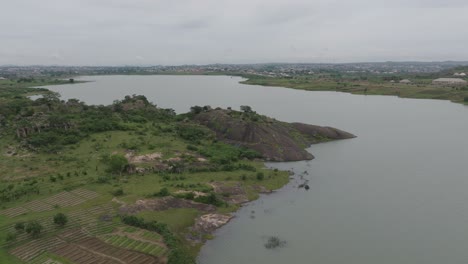 AERIAL---Lamingo-Dam-in-Jos-Plateau,-Nigeria,-forward-shot