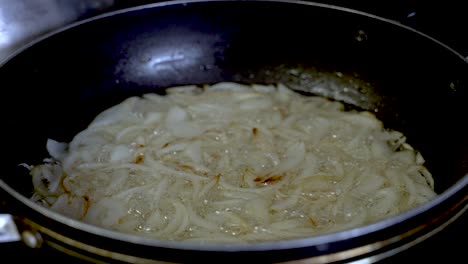 Sliced-Onions-Being-Fried-And-Simmering-In-Large-Pan