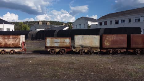 Travelling-of-ancient-wagons-used-to-carry-black-coal-in-the-mine-of-Pozo-Julia,-Fabero