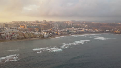 Fantastic-aerial-shot-forward-showing-the-natural-barrier-of-the-beach-and-the-wonderful-beach-of-Las-Canteras-also-the-buildings-in-the-area-can-be-seen
