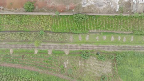 AERIAL---Railroad,-railway-at-Jos-Plateau,-Nigeria,-truck-right-top-down-shot