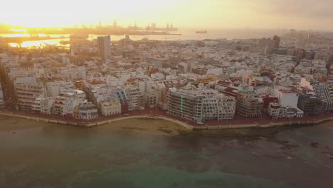 Fantastic-aerial-shot-at-sunrise-showing-the-wonderful-beach-of-Las-Canteras-and-the-buildings-in-the-area