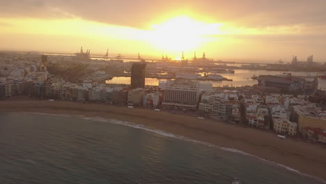 Fantastic-aerial-shot-backwards-and-at-sunrise-over-Las-Canteras-beach-and-where-the-wonderful-colors-of-sunrise-can-be-seen