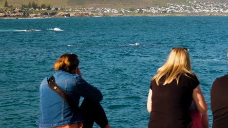 Two-women-on-coastline-whale-watching-in-Hermanus