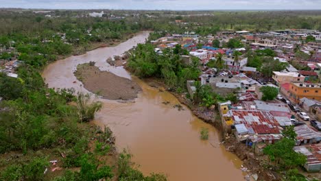 Devastated-Town-And-Muddy-Water-Of-Yuma-River-After-Hurricane-Fiona-In-Los-Platanitos-Neighborhood-in-Higuey,-Dominican-Republic