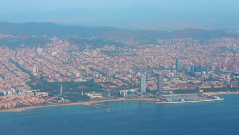 Aerial-images-from-the-window-of-the-plane-flying-over-the-city-of-Barcelona