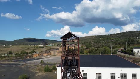 Ancient-mine-tower-and-buildings-of-an-underground-coal-mine-called-Pozo-Julia-in-Fabero-Aerial-view-1