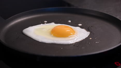 One-Fried-egg-baking-on-a-warm-pan-with-oil,-healthy-diet-for-an-animal-protein-source