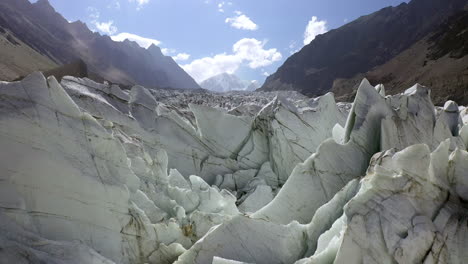 Drone-shot-of-glacier-ice-at-Fairy-Meadows-Pakistan,-slowly-rising-aerial-shot