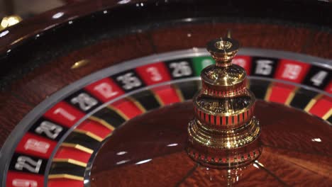 Roulette-in-casino-spinning-with-ball-on-number-six,-closeup-view