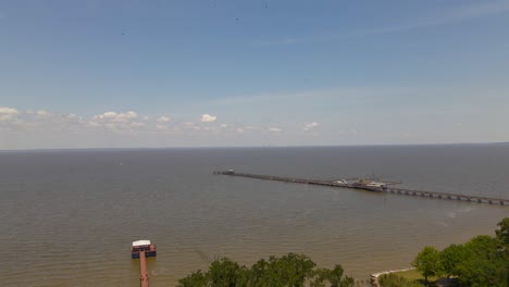 Birds-flying-at-the-drone-on-the-bay-in-Fairhope,-Alabama