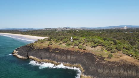 Popular-walking-track-along-the-Fingal-Heads-lighthouse-headland-with-Mount-Warning-ex-volcano-in-the-distance