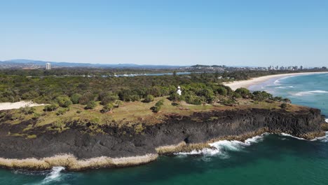 Popular-walking-track-along-the-Fingal-Heads-lighthouse-headland-with-the-Gold-Coast-skyline-in-the-distance