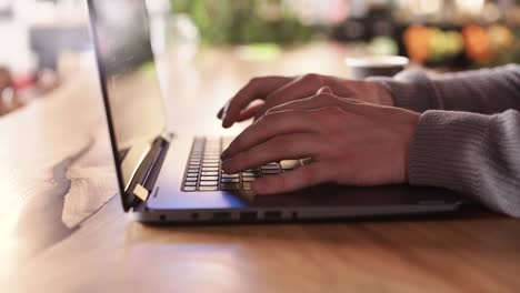 Cinematic-close-up-shot-of-man-typing-on-a-laptop-keyboard